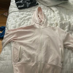 A light pink zip up hoodie from old navy active wear. Size Medium